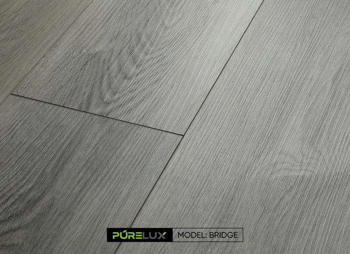 A bright and inviting living room showcasing the rich, gray brown tones of Purelux vinyl plank flooring.