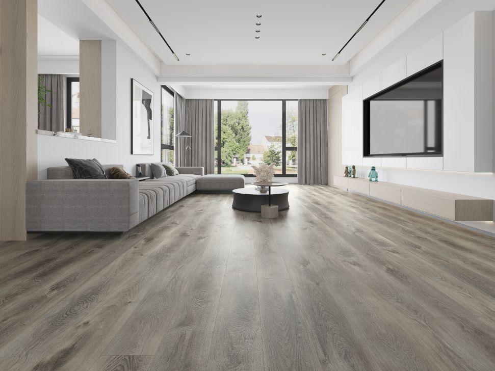 A bright and inviting living room showcasing the rich, gray brown tones of Purelux vinyl plank flooring.