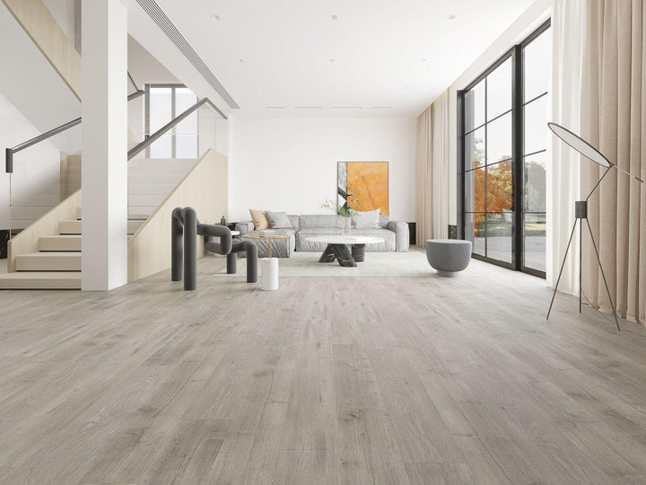 A bright and inviting room showcasing the rich, gray tones of Purelux laminate flooring.